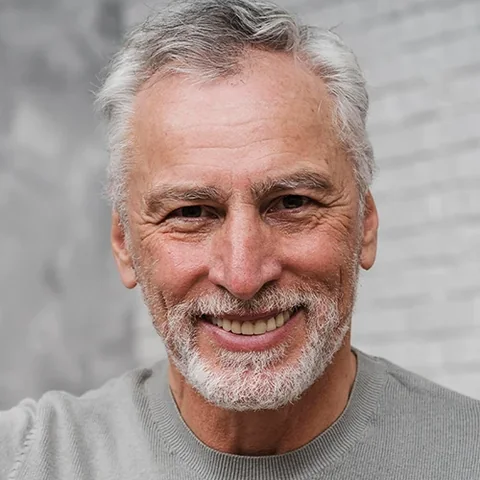 Smiling adult, an illustration of who BreathiZen is made for